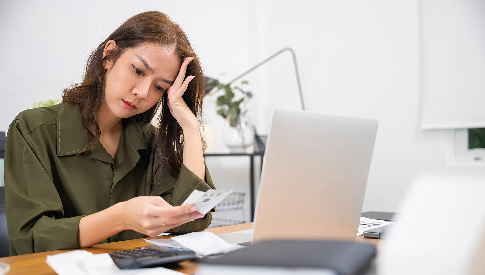 renter researching free rental assistance 2026 options using phone and laptop to find local help